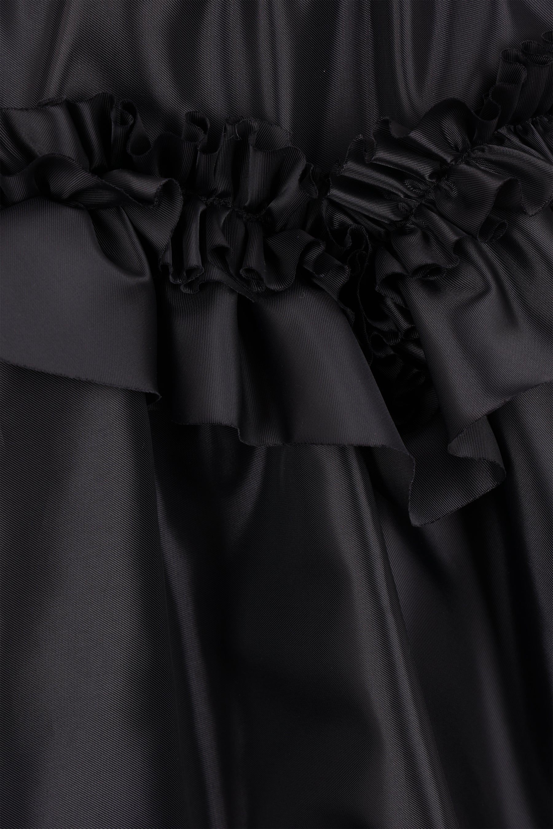 Nylon balloon skirt with ruffled hemline.